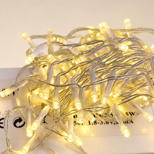 String lights on a warm-white studio backdrop-12 Warm White Flashing Christmas String Lights – 50 Bulbs
